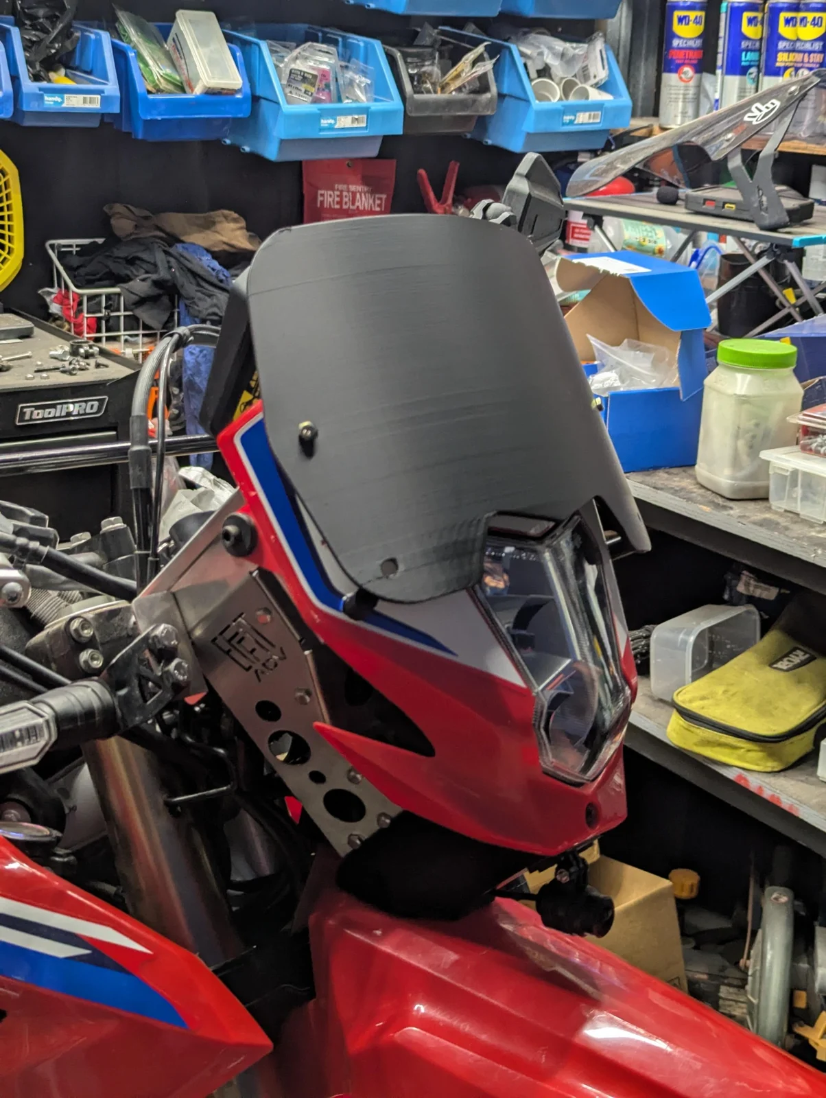 Front three-quarter view of the C1 prototype on a CRF300L